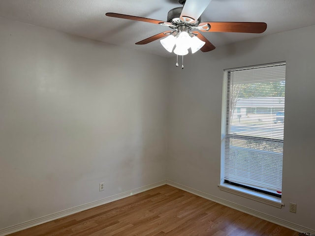 empty room featuring light hardwood / wood-style flooring and ceiling fan