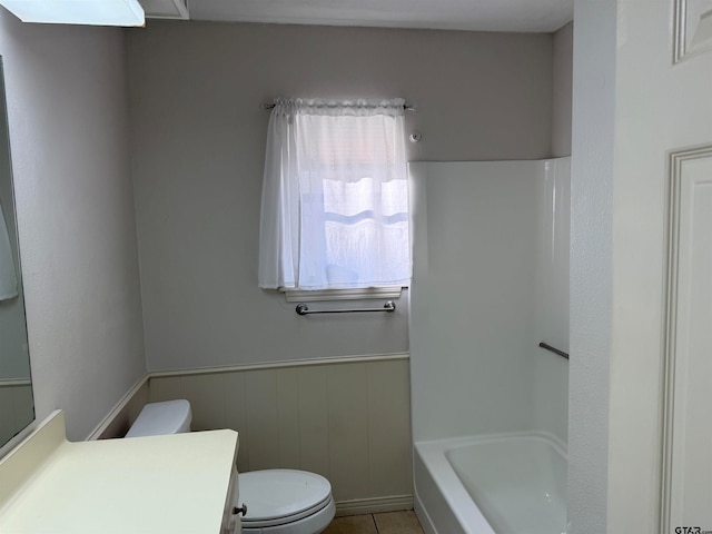 bathroom with tile patterned floors, vanity, and toilet