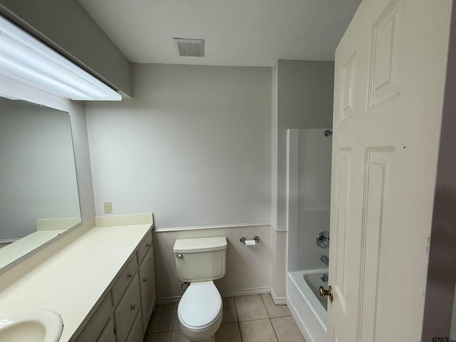 full bathroom featuring shower / bath combination, tile patterned floors, toilet, a textured ceiling, and vanity