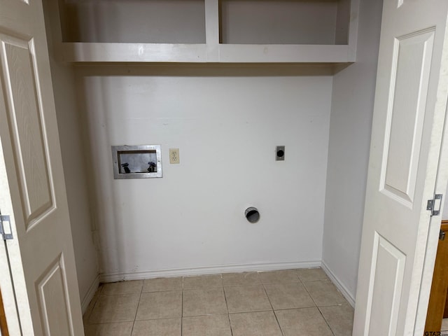 laundry room featuring hookup for a washing machine, light tile patterned floors, and electric dryer hookup