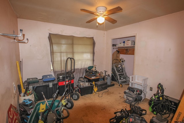 interior space featuring carpet floors and a ceiling fan