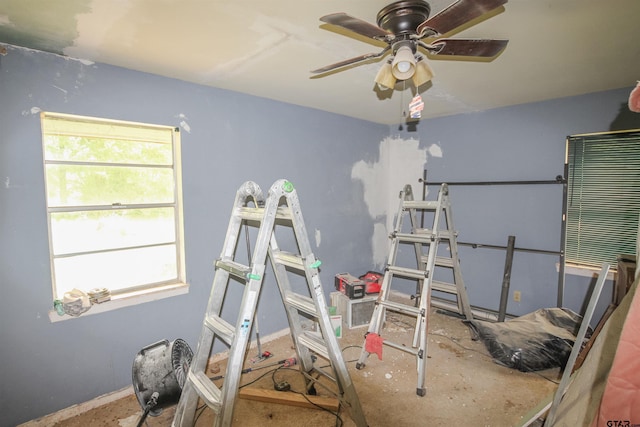 bedroom featuring baseboards and ceiling fan