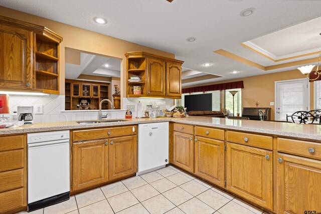 177 Paint Rock Pt, Holly Lake Ranch, TX 75765 - kitchen with open shelves, a raised ceiling, brown cabinets, a sink, and dishwasher