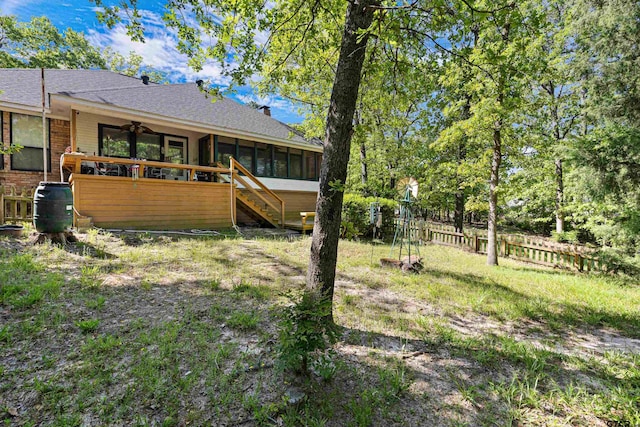 177 Paint Rock Pt, Holly Lake Ranch, TX 75765 - rear view of house with ceiling fan, fence, a sunroom, a shingled roof, and stairway