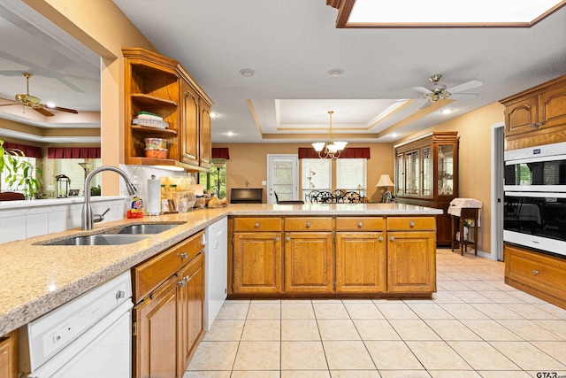 177 Paint Rock Pt, Holly Lake Ranch, TX 75765 - kitchen featuring a peninsula, open shelves, a sink, and ceiling fan with notable chandelier