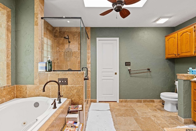 177 Paint Rock Pt, Holly Lake Ranch, TX 75765 - full bathroom featuring toilet, a jetted tub, baseboards, ceiling fan, and a stall shower