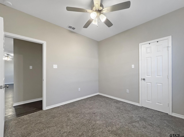 carpeted empty room with ceiling fan