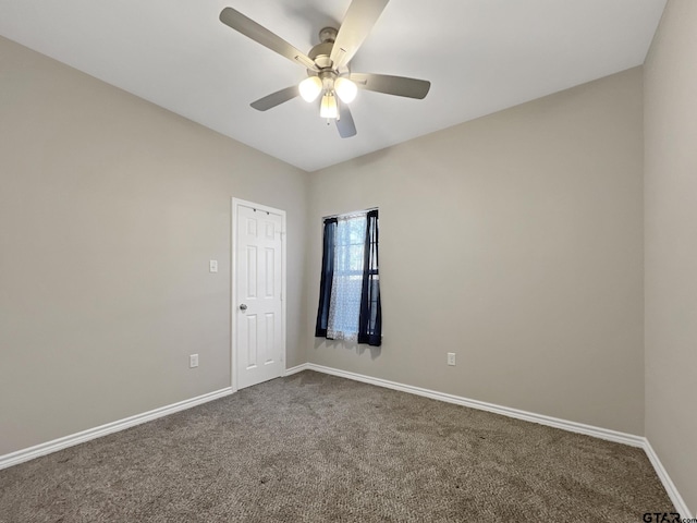 unfurnished room with carpet and ceiling fan