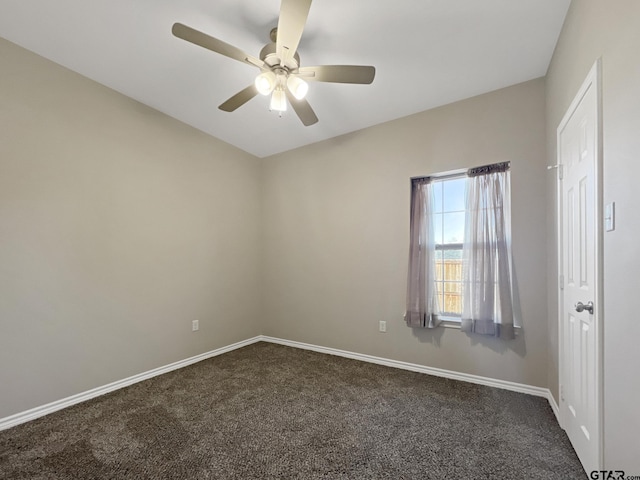 carpeted empty room featuring ceiling fan