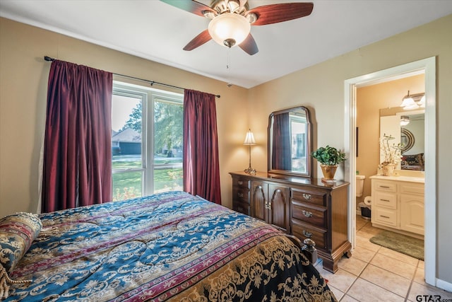 tiled bedroom featuring ceiling fan and ensuite bathroom