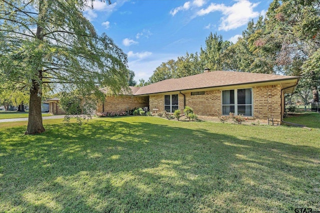 ranch-style home with a front yard