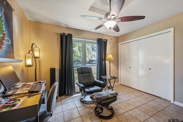 office with light tile patterned flooring and ceiling fan