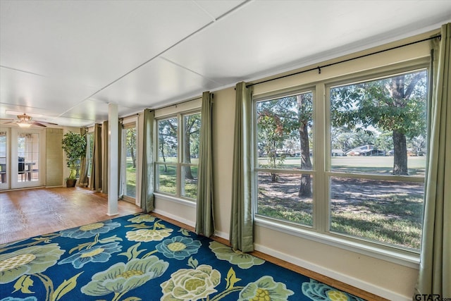 doorway to outside featuring hardwood / wood-style floors, a wealth of natural light, and ceiling fan