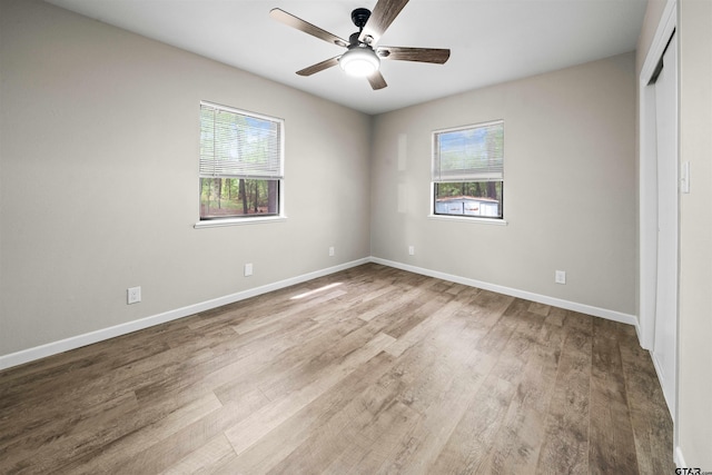 unfurnished bedroom with light wood-type flooring and ceiling fan