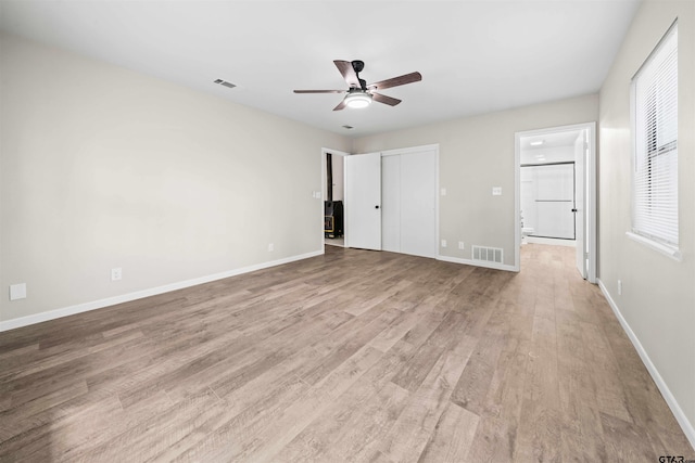 unfurnished bedroom featuring light hardwood / wood-style floors and ceiling fan