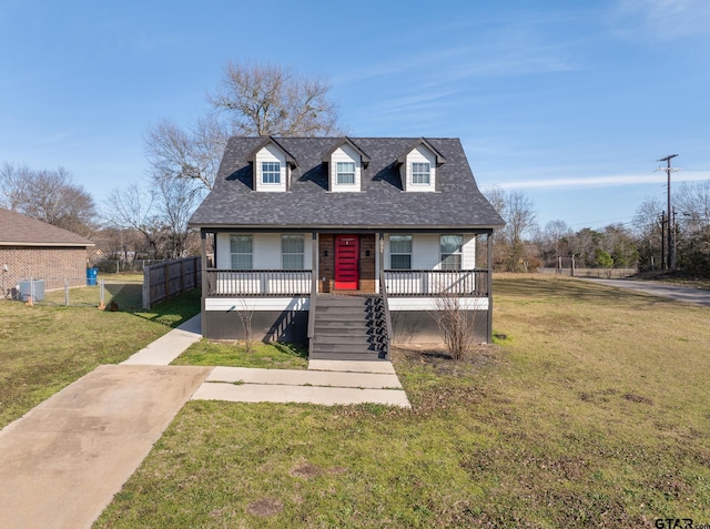 view of front of house featuring covered porch, stairway, a front yard, and fence