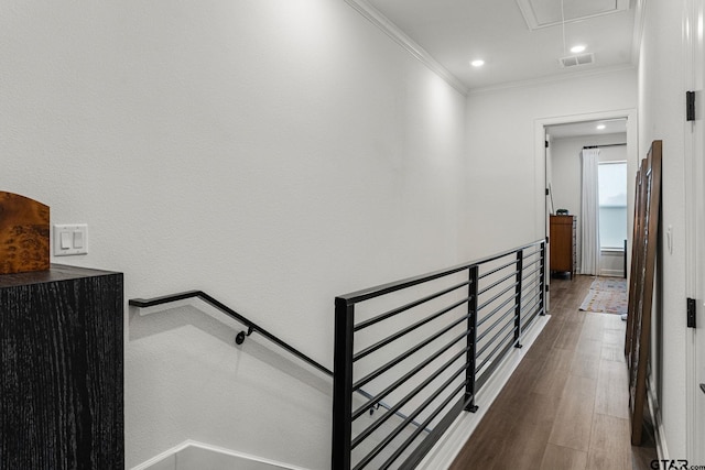 hallway with crown molding and hardwood / wood-style floors