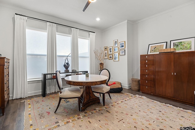 dining room with dark hardwood / wood-style flooring and ornamental molding