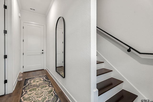 hall featuring dark hardwood / wood-style flooring and crown molding