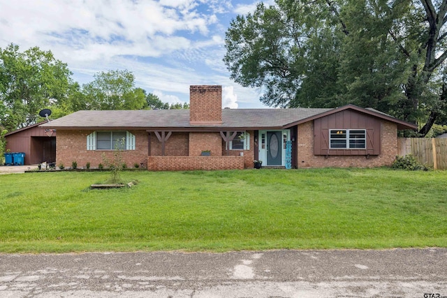 single story home with a front lawn