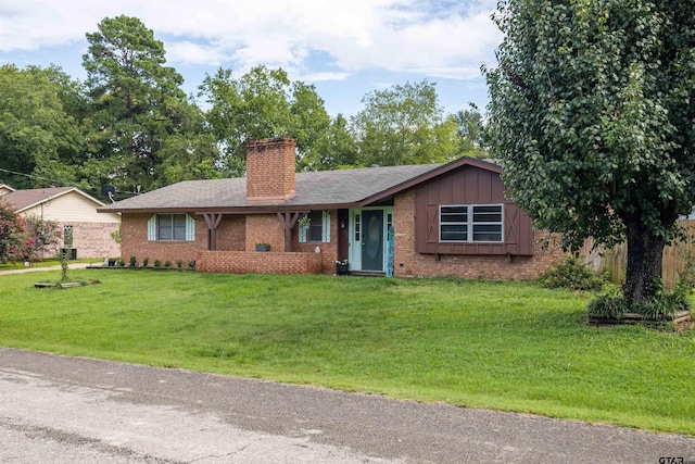 ranch-style home featuring a front yard