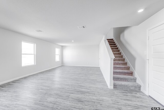 206 Parker Oaks Ct, Chandler, TX 75758 - basement with wood finished floors, stairway, recessed lighting, and baseboards