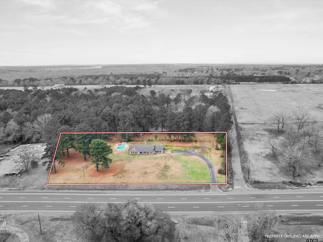 3805 N US Highway 271, Gilmer, TX 75644 - aerial view of property and surrounding area featuring property boundaries highlighted and a heavily wooded area