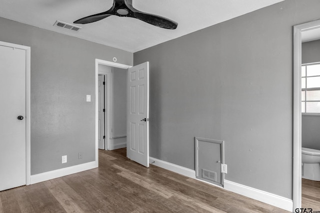 1523 Austin Dr, Tyler, TX 75701 - unfurnished bedroom featuring wood finished floors and ceiling fan