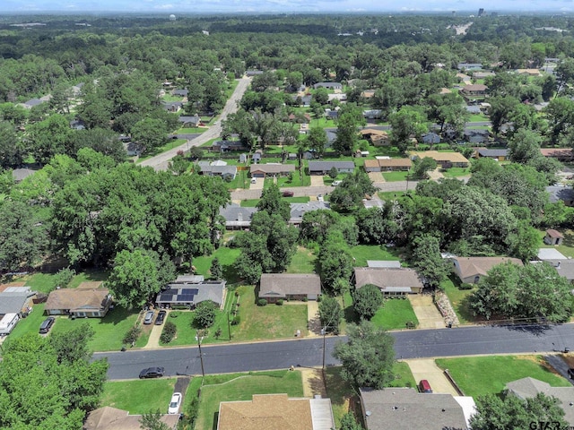 1523 Austin Dr, Tyler, TX 75701 - aerial overview of property's location featuring nearby suburban area and a heavily wooded area