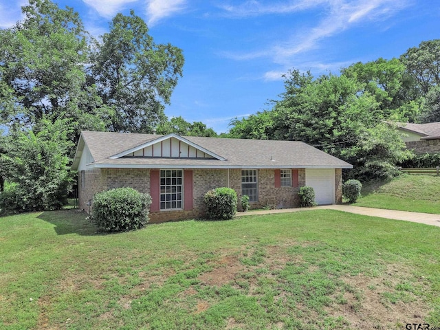 1523 Austin Dr, Tyler, TX 75701 - ranch-style home with brick siding, a front lawn, and concrete driveway