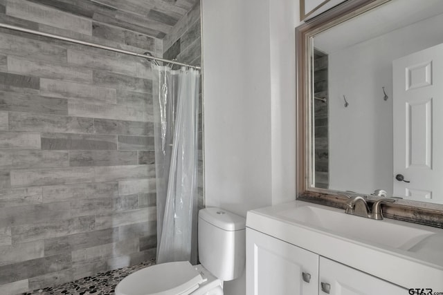 1523 Austin Dr, Tyler, TX 75701 - bathroom featuring vanity and a tile shower