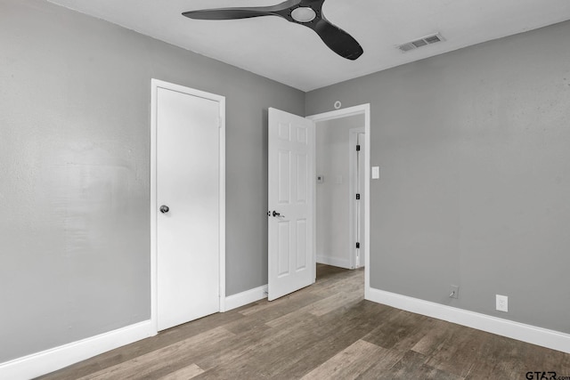 1523 Austin Dr, Tyler, TX 75701 - unfurnished bedroom featuring wood finished floors and ceiling fan