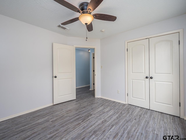 15509 Cedar Bay Dr, Bullard, TX 75757 - unfurnished bedroom featuring visible vents, a closet, wood finished floors, baseboards, and ceiling fan