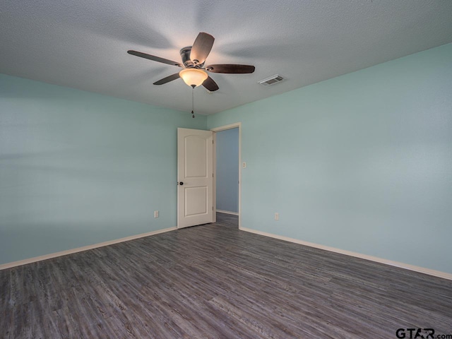 15509 Cedar Bay Dr, Bullard, TX 75757 - spare room with ceiling fan, a textured ceiling, baseboards, visible vents, and dark wood-style floors