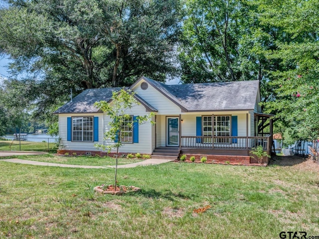 15509 Cedar Bay Dr, Bullard, TX 75757 - single story home with a front lawn, fence, covered porch, a shingled roof, and crawl space
