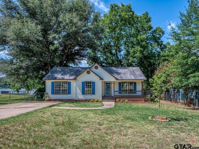 15509 Cedar Bay Dr, Bullard, TX 75757 - ranch-style house with a porch, fence, and a front lawn