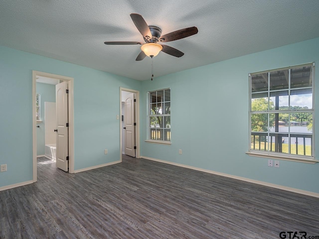 15509 Cedar Bay Dr, Bullard, TX 75757 - spare room with baseboards, a textured ceiling, dark wood-style flooring, and ceiling fan