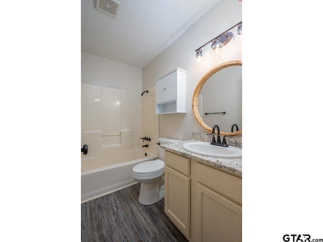 15509 Cedar Bay Dr, Bullard, TX 75757 - bathroom featuring vanity, shower / bathtub combination, toilet, wood finished floors, and visible vents