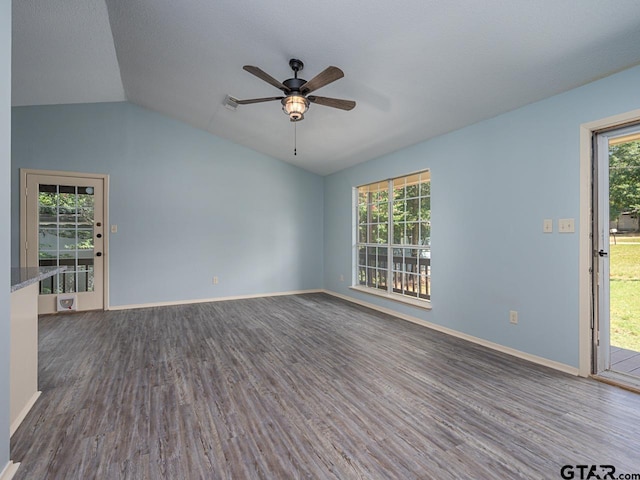 15509 Cedar Bay Dr, Bullard, TX 75757 - spare room featuring vaulted ceiling, baseboards, a ceiling fan, and dark wood finished floors