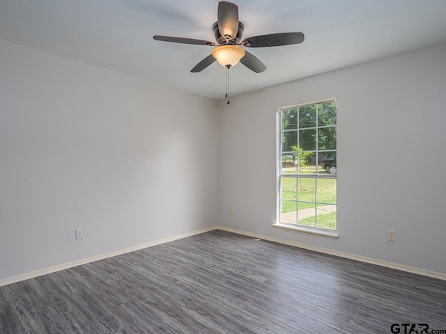 15509 Cedar Bay Dr, Bullard, TX 75757 - unfurnished room featuring dark wood-style flooring, a ceiling fan, and baseboards