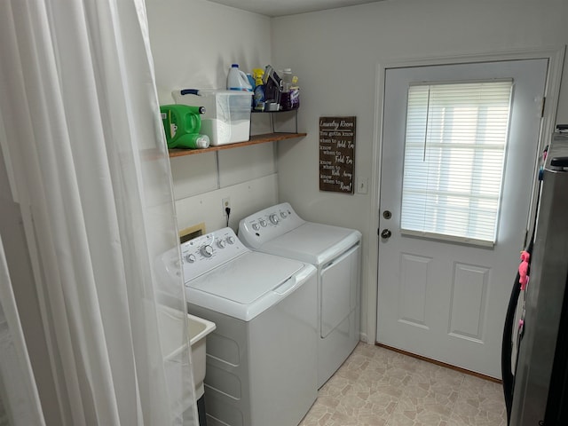 washroom with light tile patterned floors and independent washer and dryer