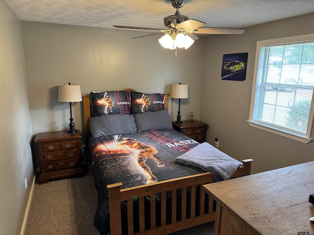 carpeted bedroom with a textured ceiling and ceiling fan