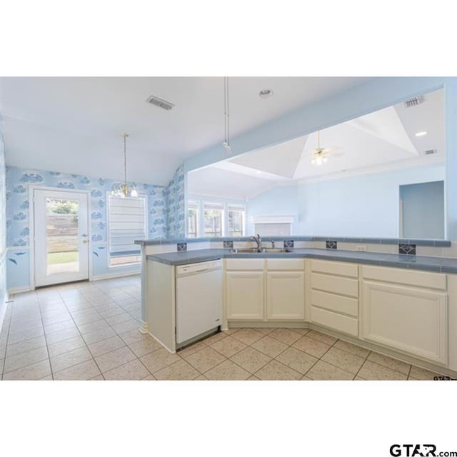 2060 Rana Park, Flint, TX 75762 - kitchen featuring white dishwasher, vaulted ceiling, light tile patterned floors, wallpapered walls, and decorative light fixtures