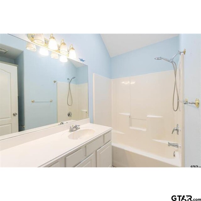 2060 Rana Park, Flint, TX 75762 - bathroom with washtub / shower combination, vanity, and vaulted ceiling