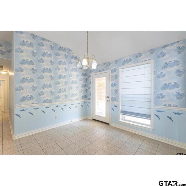 2060 Rana Park, Flint, TX 75762 - unfurnished dining area with a chandelier, vaulted ceiling, light tile patterned flooring, and wallpapered walls