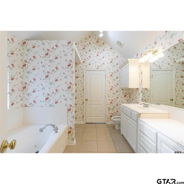 2060 Rana Park, Flint, TX 75762 - bathroom with tile patterned flooring, vanity, wallpapered walls, a whirlpool tub, and vaulted ceiling