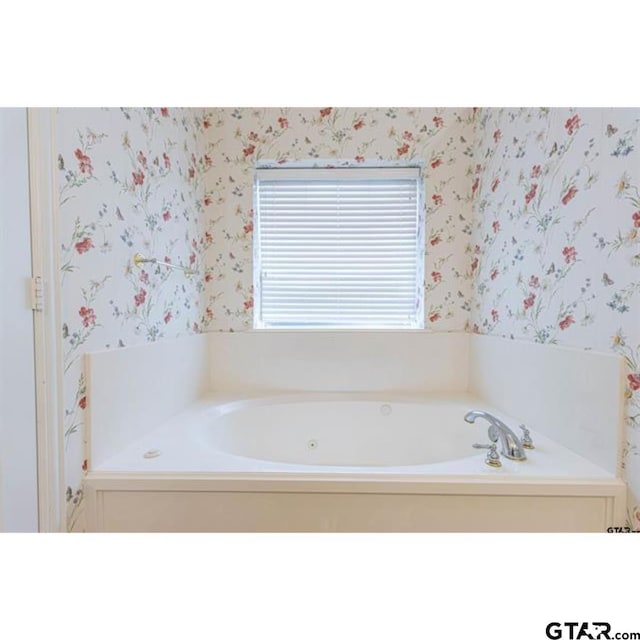 2060 Rana Park, Flint, TX 75762 - bathroom featuring wallpapered walls and a jetted tub