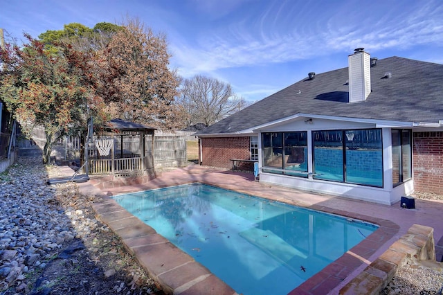 view of swimming pool featuring a gazebo and a patio