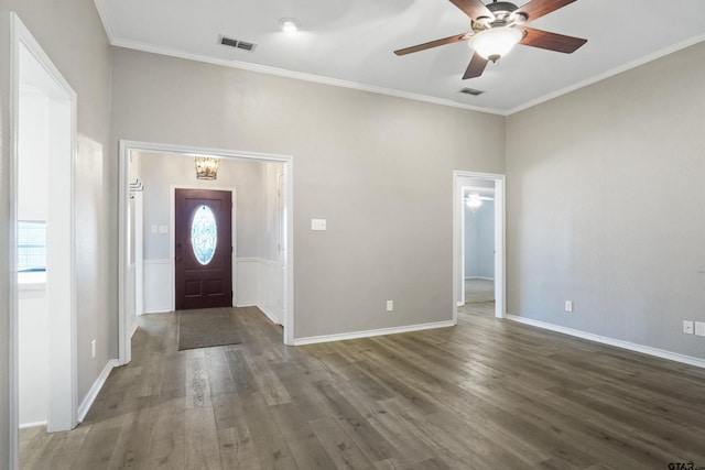 entryway featuring dark wood-type flooring, crown molding, and ceiling fan