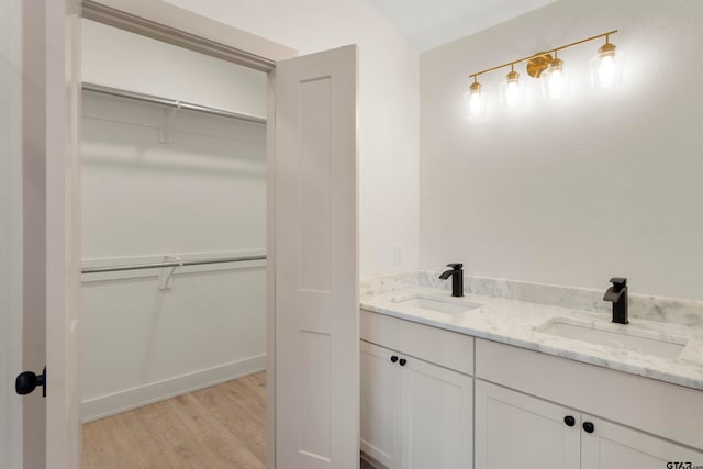 bathroom featuring vanity and hardwood / wood-style flooring